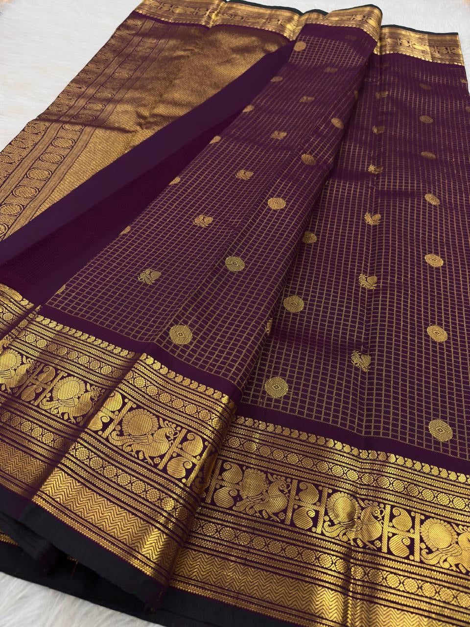 Aubergine Kanchipuram saree with Mayil zari border