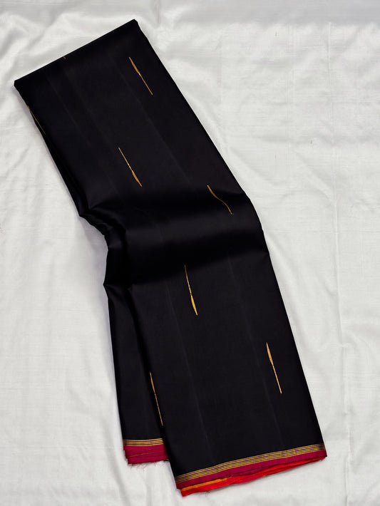 Pure silk Kanchipuram saree in Kanchana Deep Brown with Thirushnam Orange, traditional handwoven border and zari detail