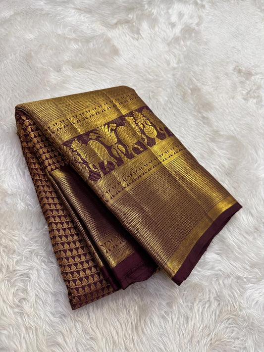 Handwoven maroon brown Kanchipuram silk with grand traditional elephant zari border.