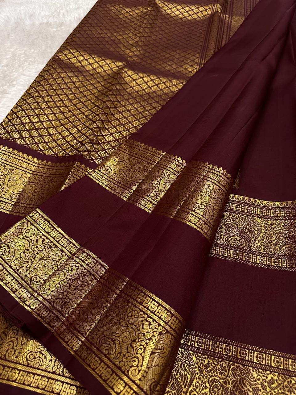 Deep maroon Kanjipuram silk saree folded, full view