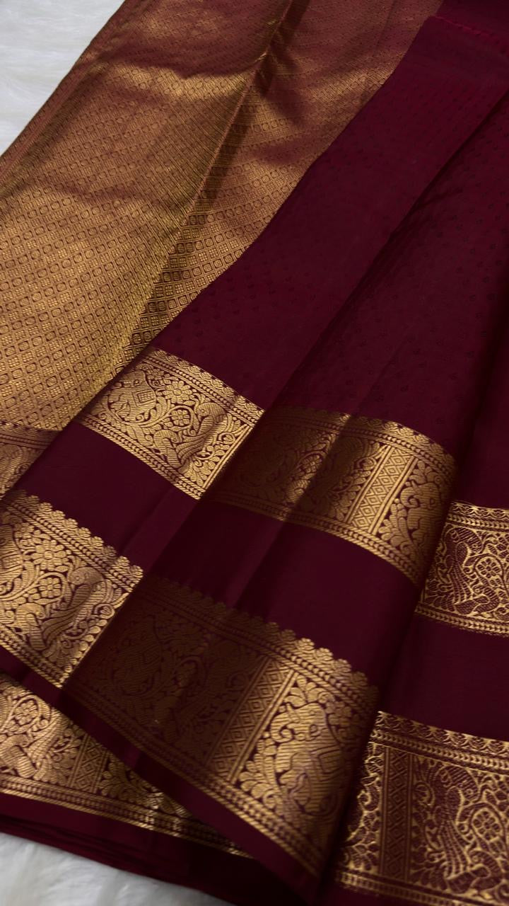 Deep red Kanjeevaram saree with gold zari pallu