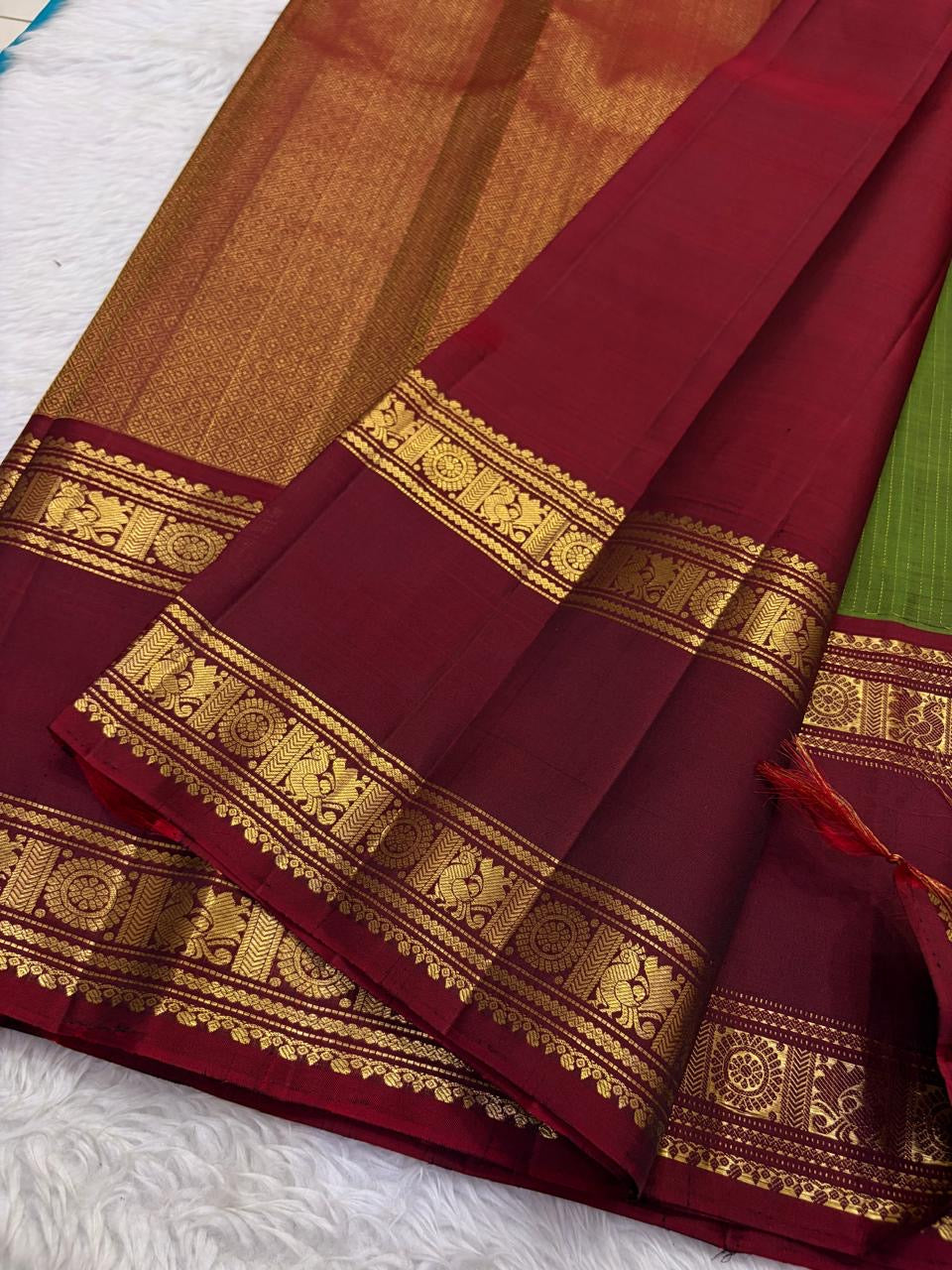 Olive Green and Deep Maroon Handwoven Pure Silk Kanjivaram Saree with Sorgavaasal Mayil Border
