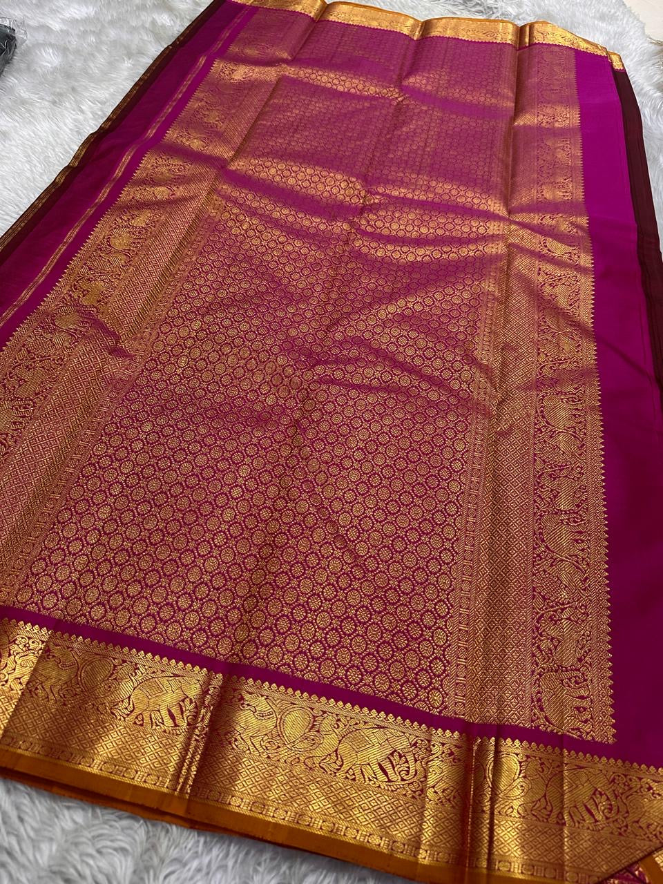 Full zari woven magenta pallu spread with gold pattern, shipped from New Jersey USA.