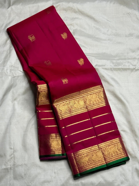 Pure Kanjivaram silk saree featuring varisaipet border and mayil yazhi motifs.