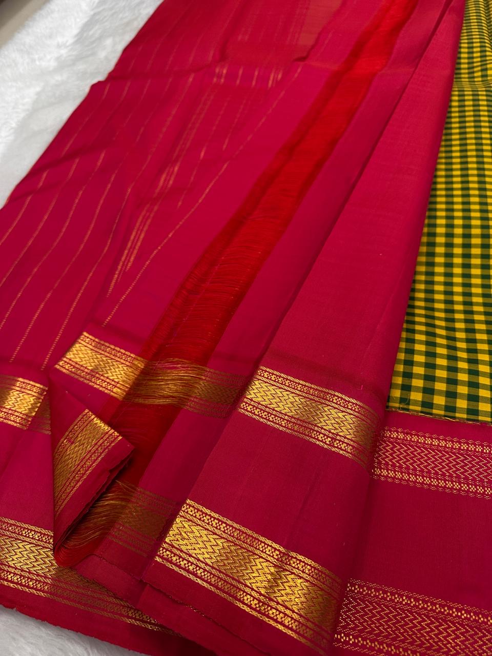 Festive Kanchipuram silk saree yellow green kattam body with brick red rettapet border flatlay Idam Living
