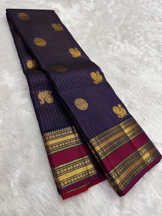 Draped deep plum purple Pure Kanchipuram silk saree with gold zari woven motifs and maroon border bands, shipped from New Jersey USA