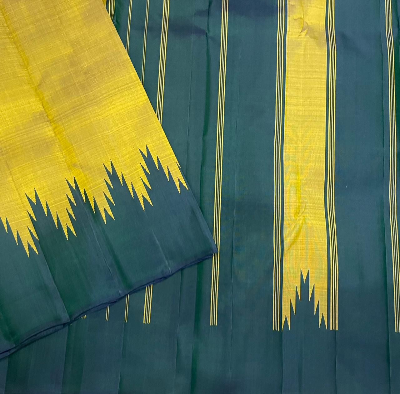 Close view of forest green striped pallu with Thazampoo Reku motif on Pure Kanchipuram Silk Saree
