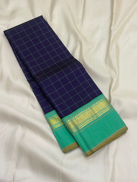 Long fold view of navy grid checked Pure Kanchipuram silk saree with sea green and gold zari woven border