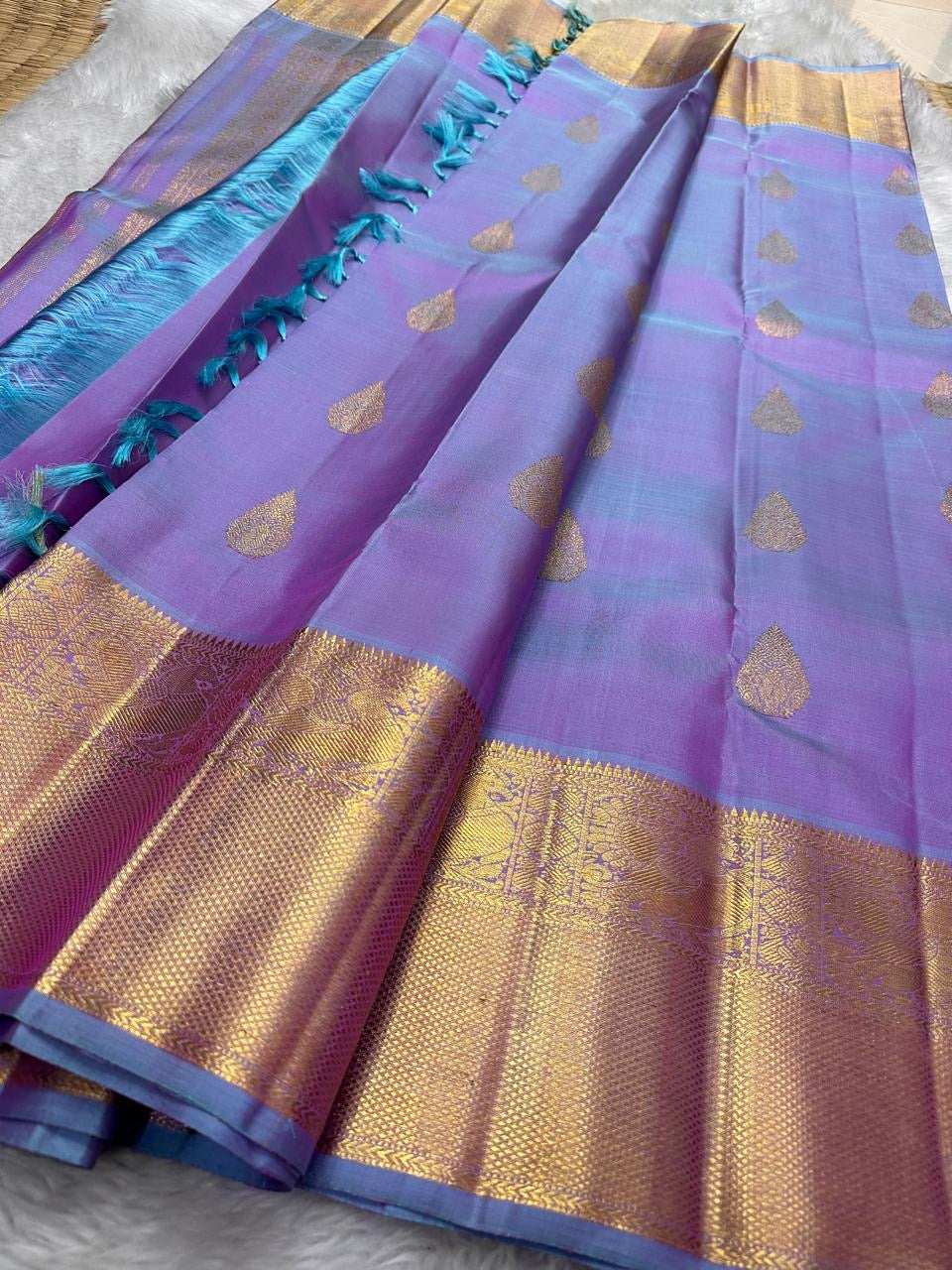 Handwoven double-shot Butta Kanchipuram silk saree, folded