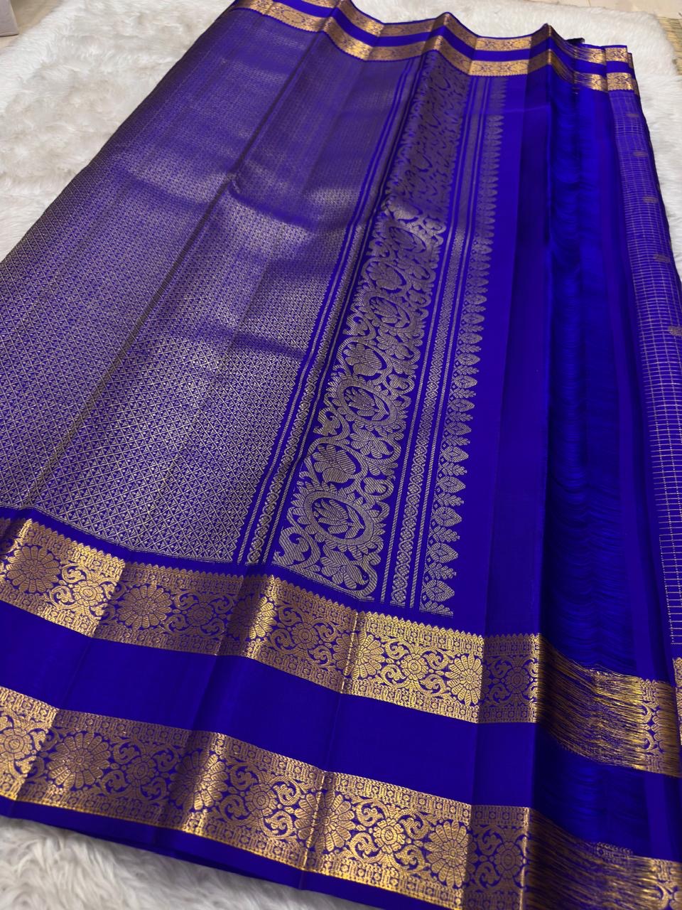 Handwoven pure silk Kancheepuram saree in royal blue with Zari Kattam body Mayil Chakram butta and ornate antique gold zari border Silk Mark certified