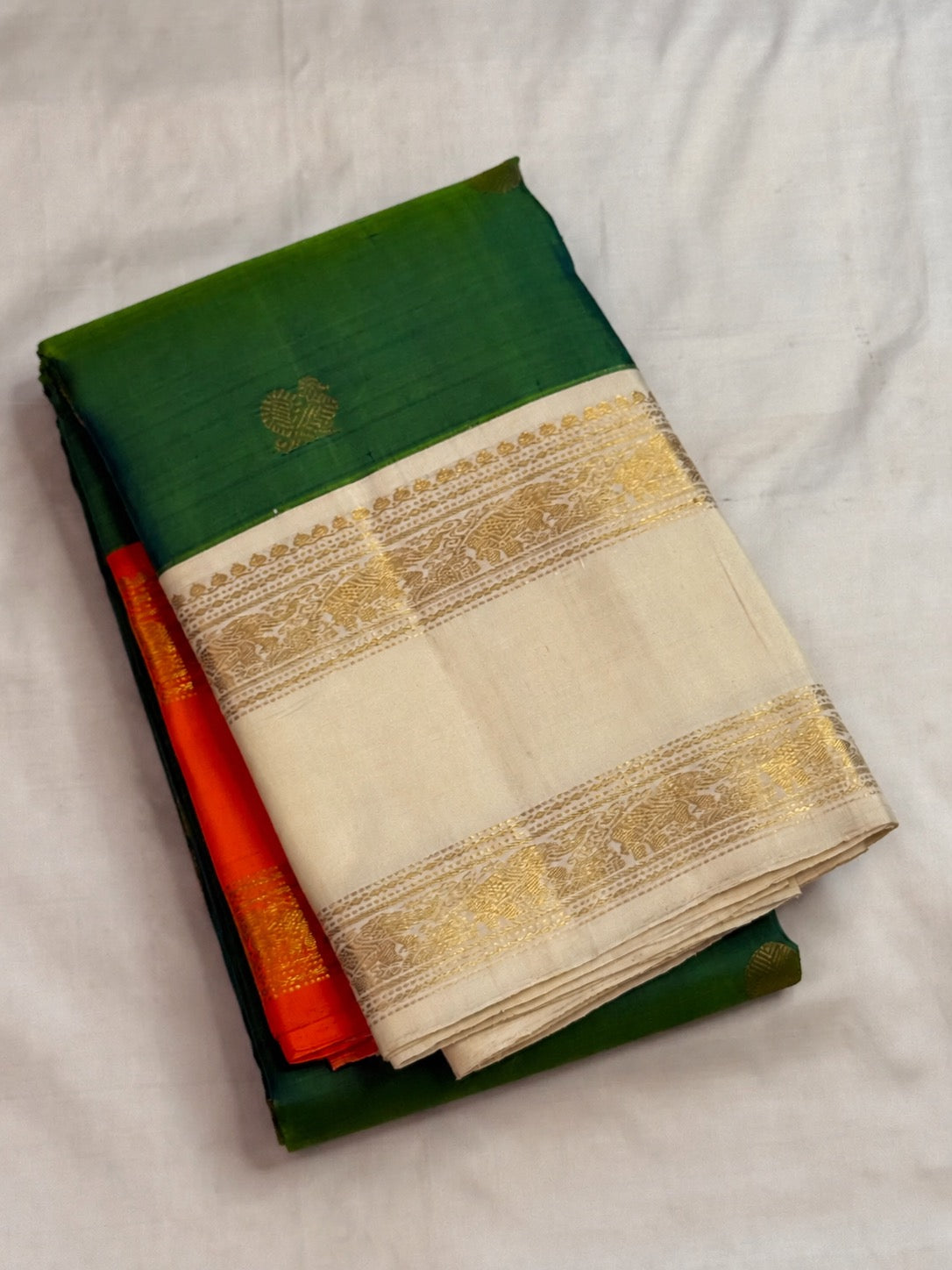 Double-shot leaf-to-emerald green with golden-mustard light pure silk Kanchipuram saree, green mustard double shot silk body; traditional Rettapet weave.