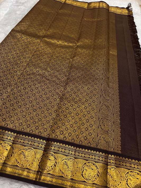 Deep coffee brown Kanjipuram silk saree body close-up showing Vairaoosi fine needle-like zari shimmer and Kamalam lotus gold zari butta