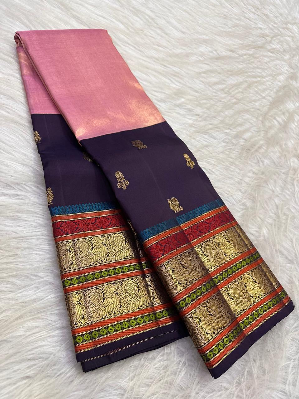 Rose pink tissue silk surface with warm gold zari handwoven detail