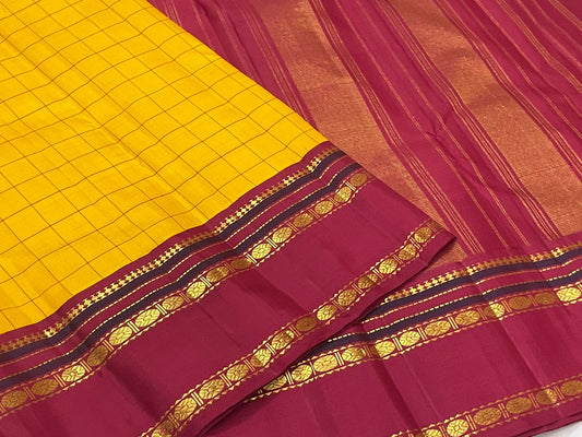 Amber Kattam Turmeric Silk Kanchipuram Saree with Kungumam Red Rettapet Border