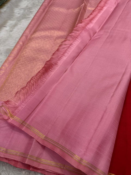 Full view of handwoven crimson vermilion Kanjivaram silk saree showing Gandaberunda Butta and pastel pink selvedge border