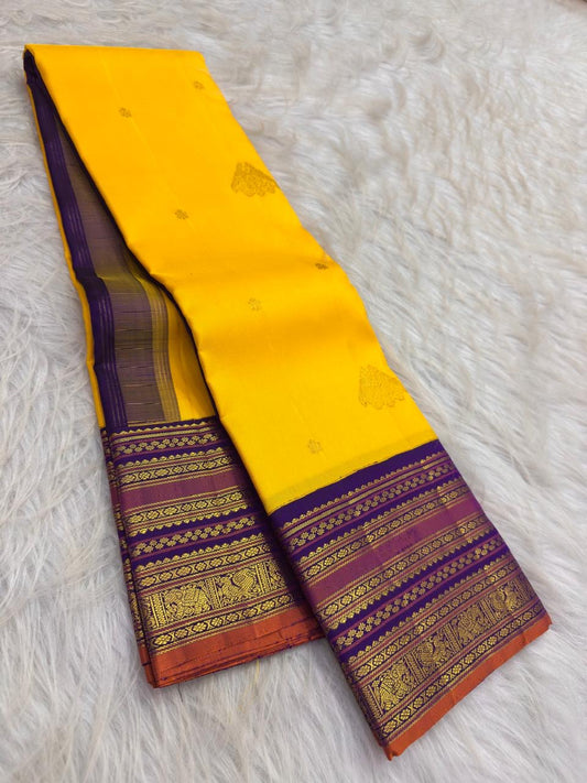 Full view of yellow pure silk Varisaipet saree with contrasting traditional border and decorative pallu
