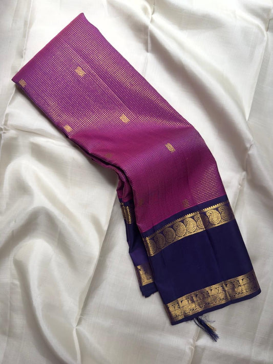 Raspberry pink Kanjivaram saree with royal purple Rettapet border, close view