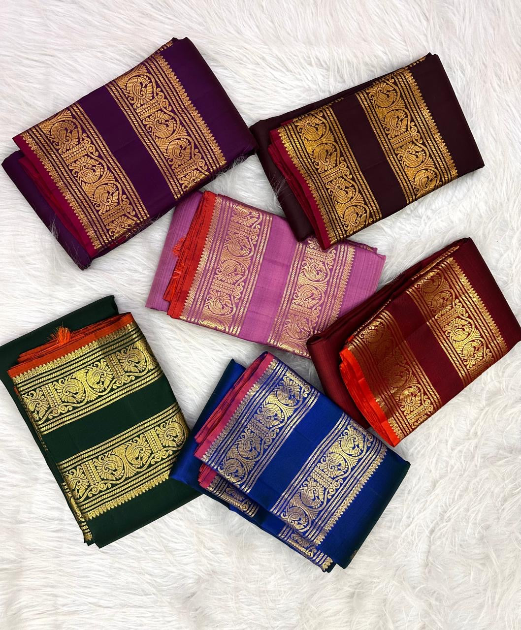 Folded deep maroon Rettapet Kanjipuram silk saree with vermilion selvedge