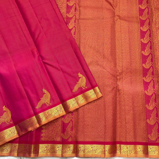 Close view of hot pink KanchiPattu silk body with fine Vairaoosi zari lines running horizontally across the field
