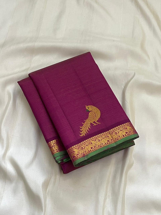 Close view of hot pink Kanjipuram silk body with fine Vairaoosi zari lines running horizontally across the field