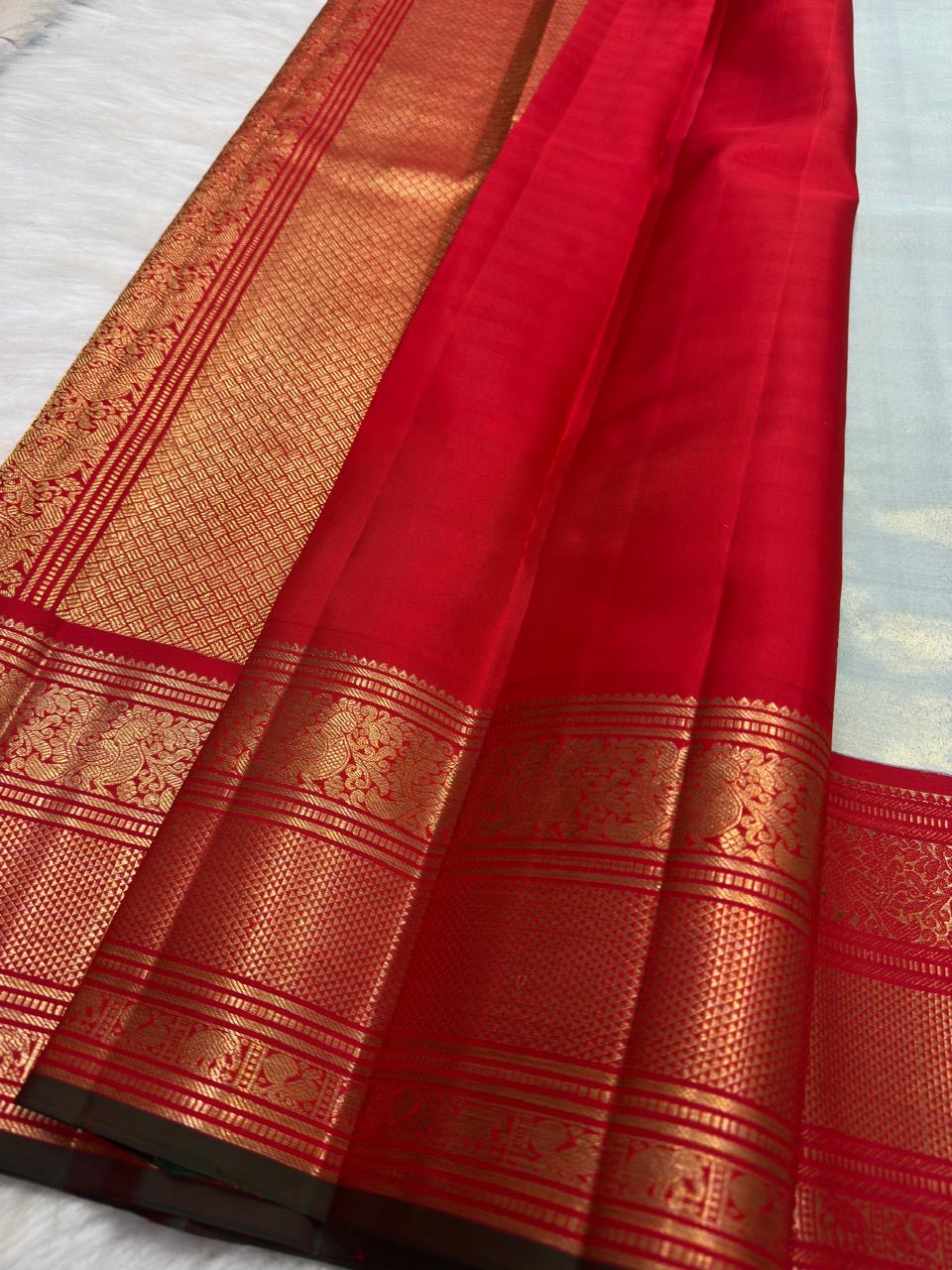 Ice blue Kanchi Pattu tissue Korvai saree with red border