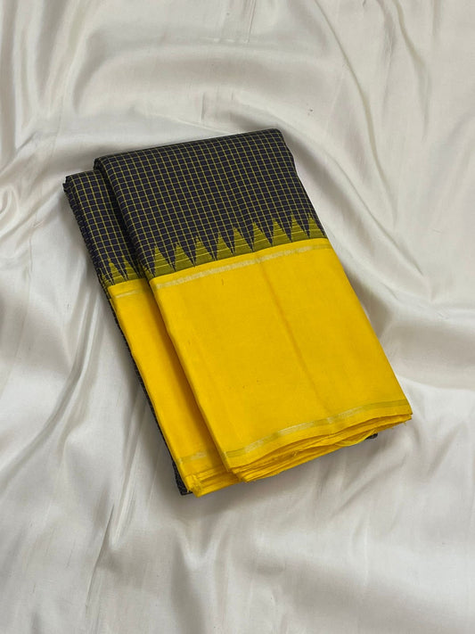 2. Pure Kanchipuram silk saree deep green body with vibrant yellow border kanchi kattam checks draped view