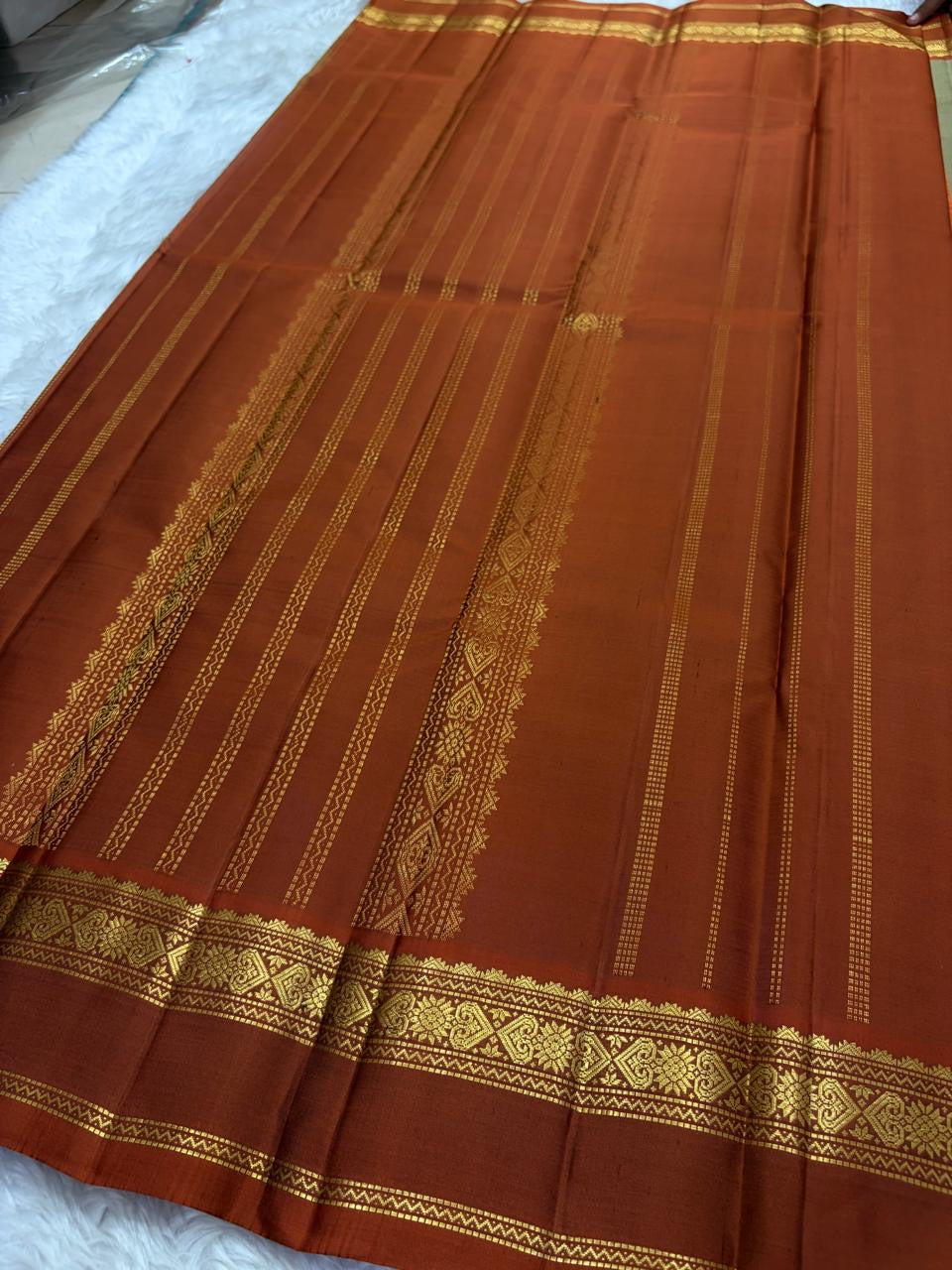 Olive and Rust Handwoven Pure Silk Kanchipuram Saree with Gold Zari Floral Border.