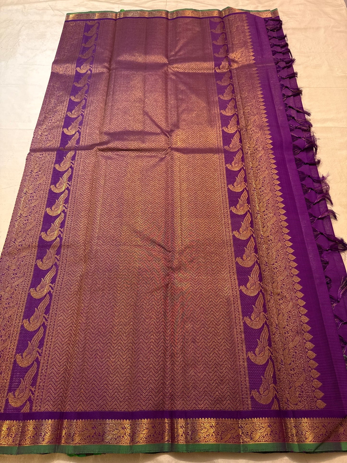 Close-up of Meenakari peacock border detailing on Royal Violet Vairaoosi saree