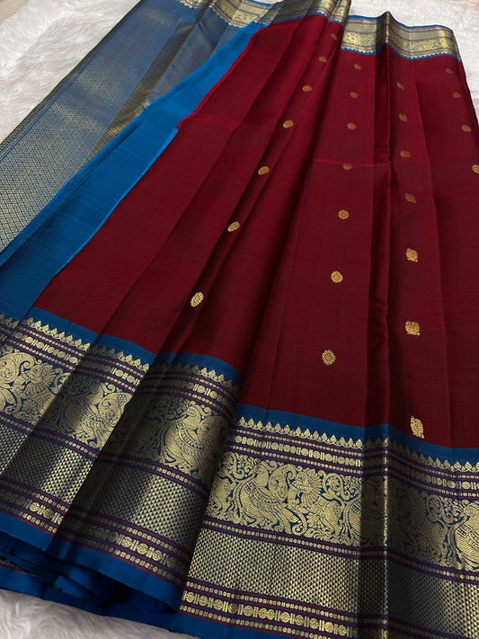 Pure Kanchipuram Silk Saree Burnished Ruby with Indigo Korvai Border and Mayil Butta