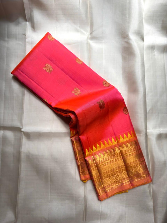 Kanjivaram silk saree coral pink with rich gold zari pallu and traditional motifs