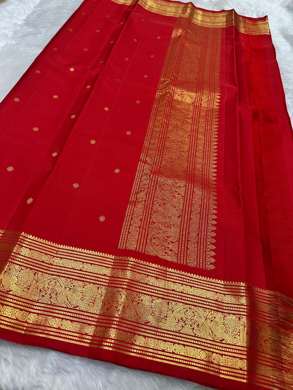 deep red Kanchipuram silk saree with blouse piece