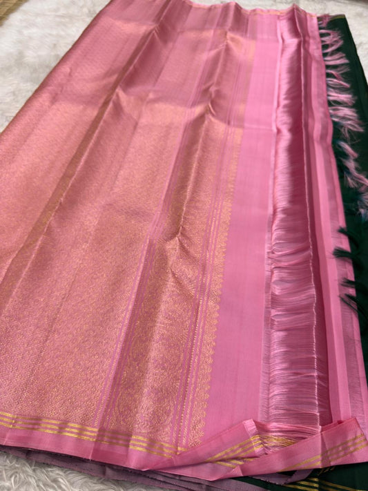 Bottle green and pink handwoven pure silk Kanchipuram Butta saree — close view of the body weave and texture