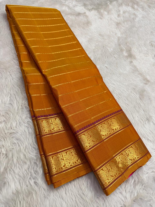plum border detail of mustard gold Kanchipuram silk saree