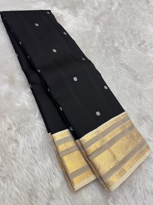 Black Kanjivaram silk saree ivory butta antique gold zari border korvai weave draped view