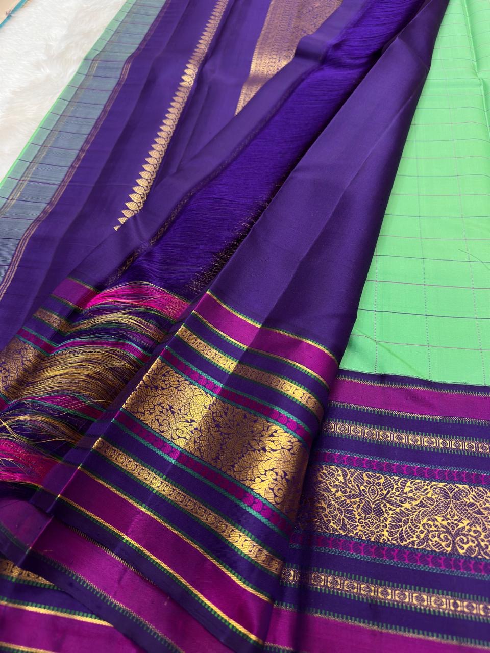 Pure Kanjivaram silk saree in aqua with kanchi kattam pattern and zari woven plum border styling view