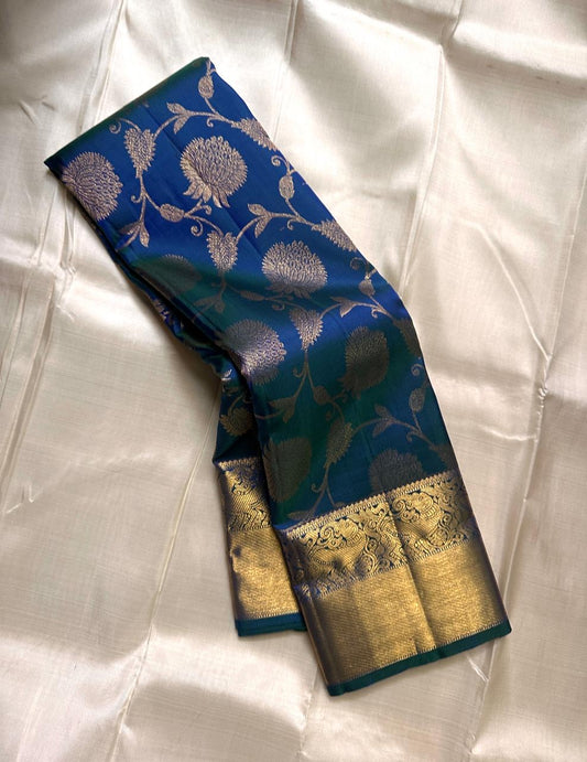 Blue Kancheepuram silk saree featuring floral jaal pattern with gold zari detail