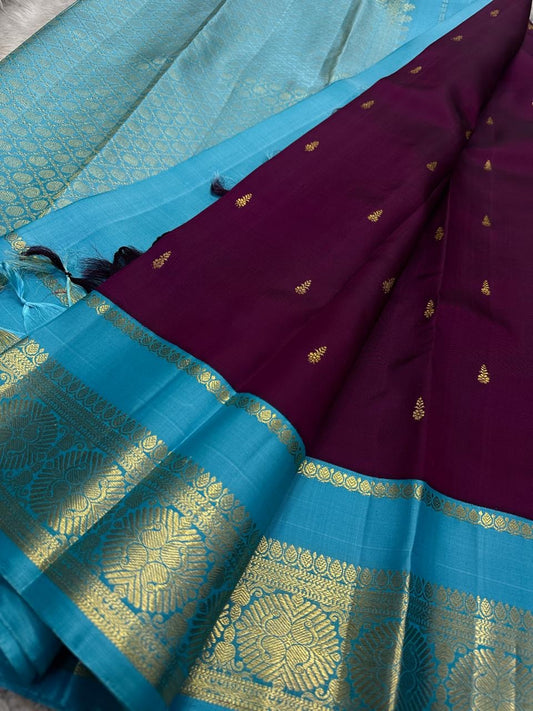 Kanjivaram silk saree berry body with bright cerulean zari border detail closeup
