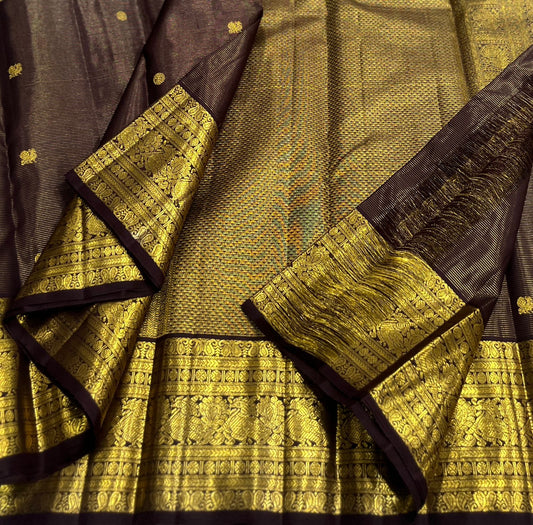 Deep cocoa brown Kanjivaram silk saree with antique gold pallu folded view
