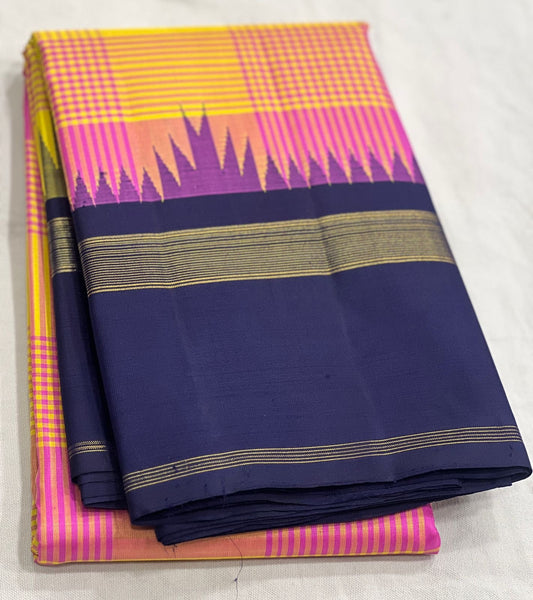 Kanchipuram silk saree folded view showing yellow pink and navy contrast