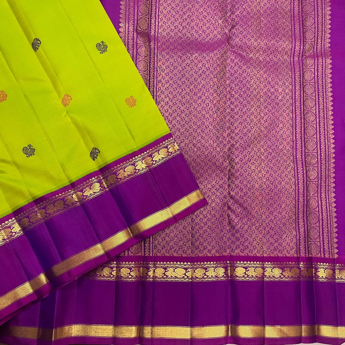 Pure Kanjivaram silk saree in green with mayil motifs and traditional zari woven rettapet border