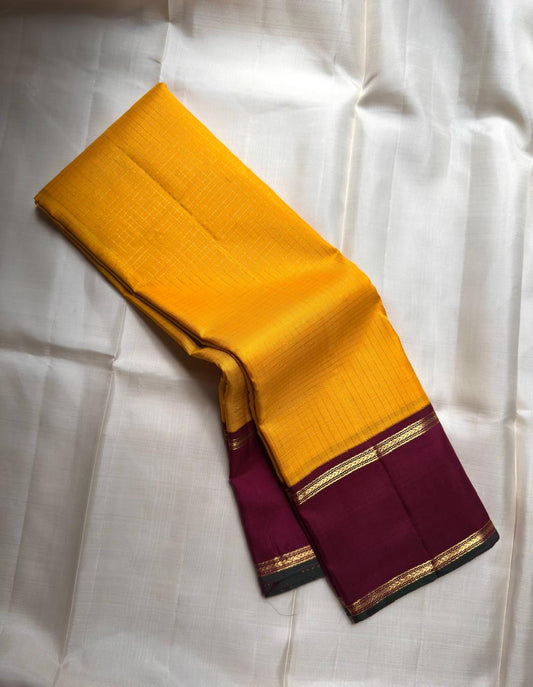 Kancheepuram silk saree yellow body with green blue shot border detail