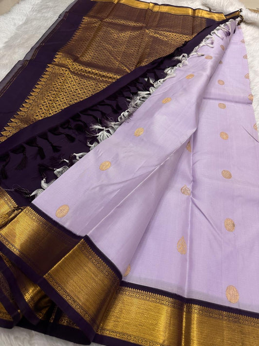 soft lilac kanjivaram saree with gold zari woven buttas draped view