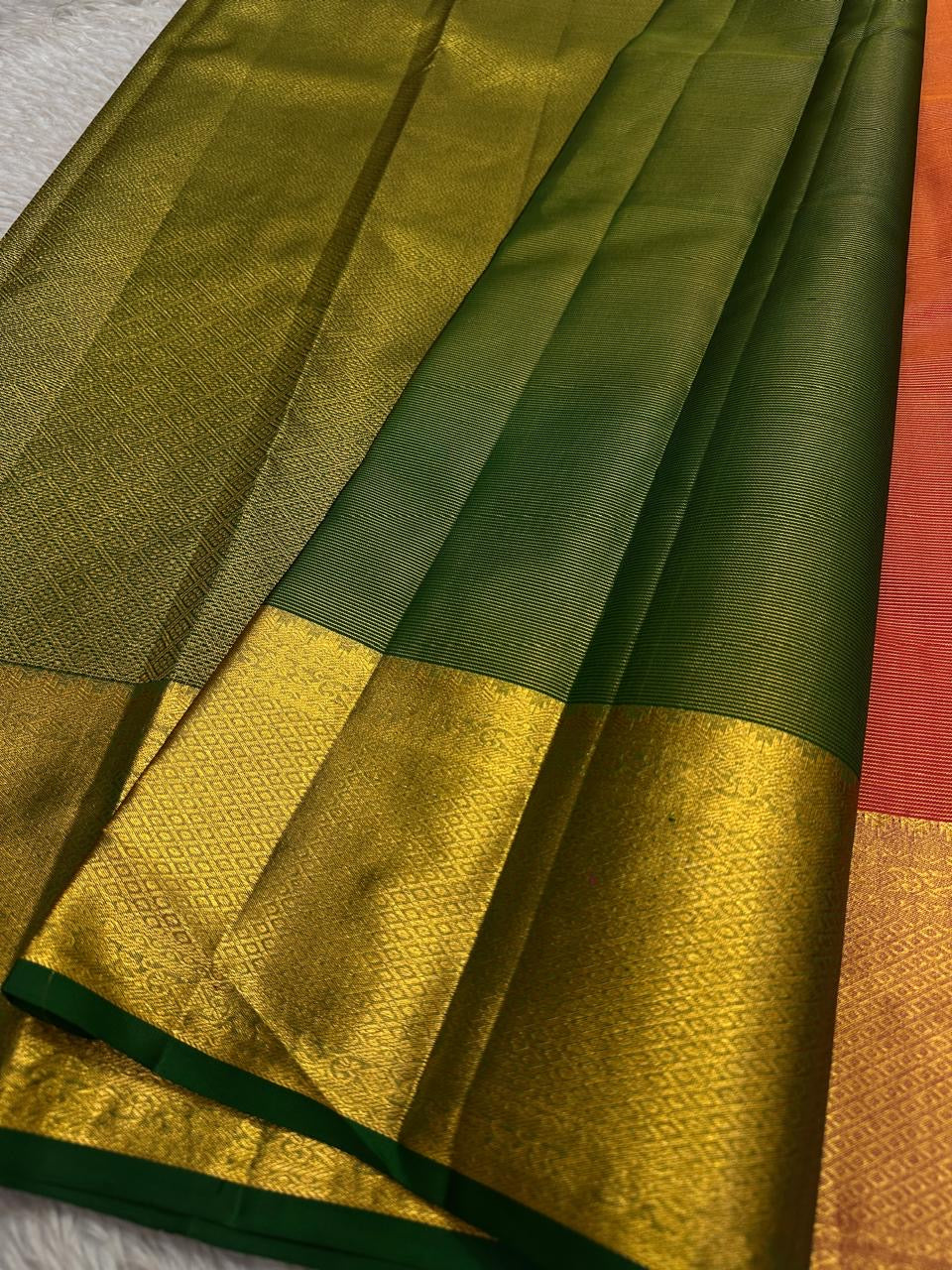Kanjivaram silk saree green selvedge detail with gold border