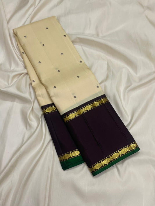 Kanjivaram silk saree white body with rettapet purple border draped view