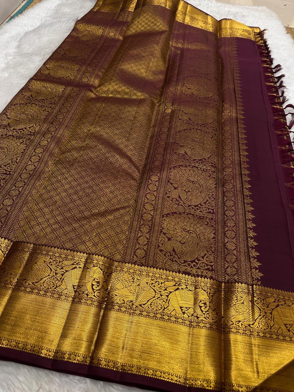Kanchipuram silk saree zari kattam grid pattern plum closeup