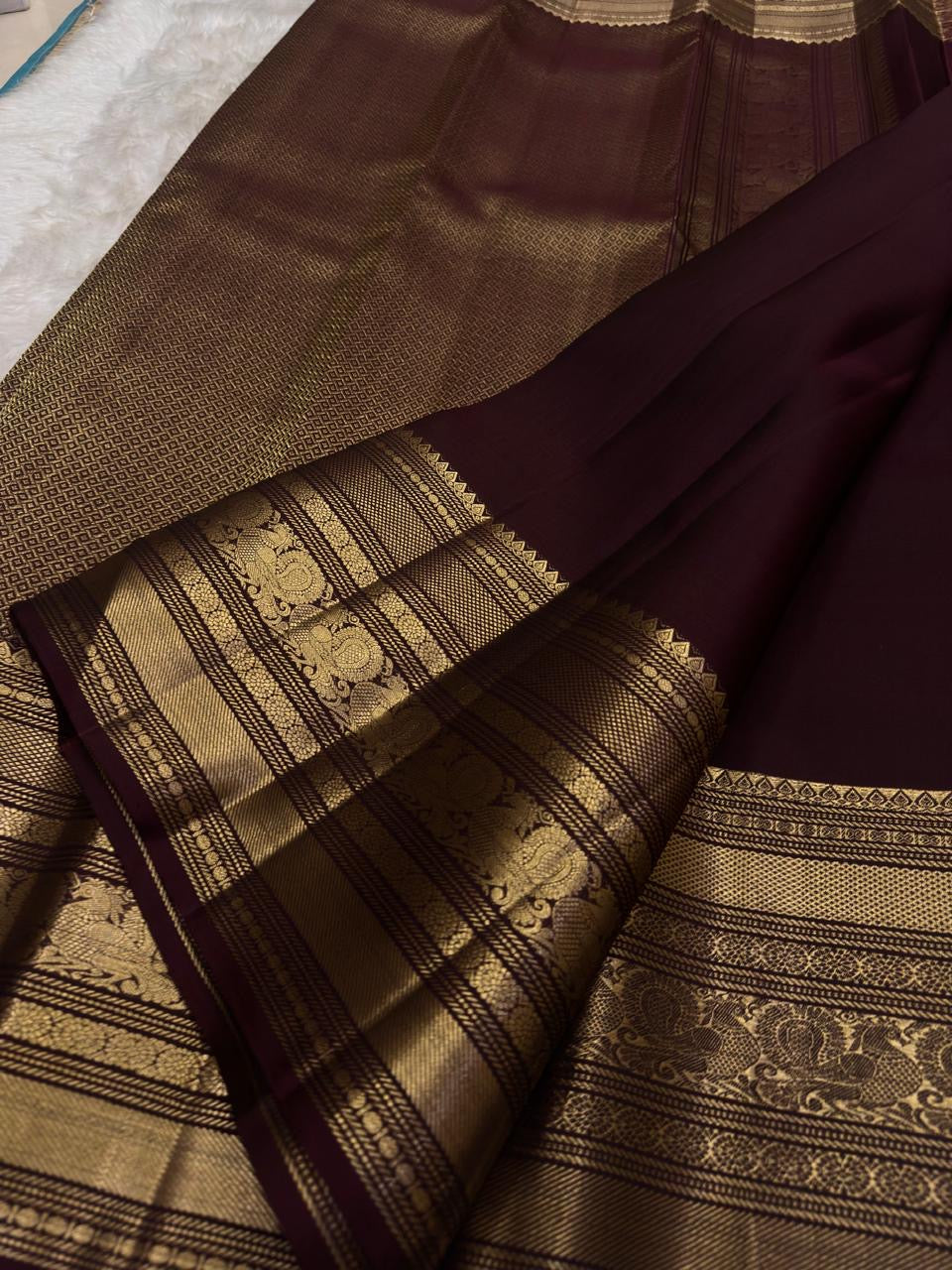Espresso brown pure silk Kanchipuram saree with antique gold mayil chakram buttas, peacock-green detailing, and a detailed peacock and arai maadam pallu, view 4.