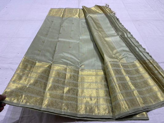 Sage green handwoven pure silk Kanchipuram Varisaipet saree — overview of the full saree drape
