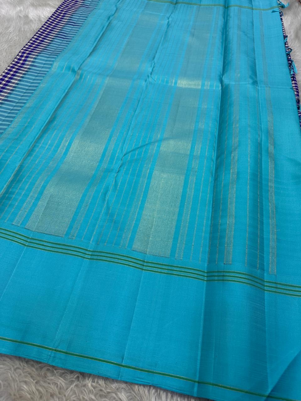 Handwoven turquoise Kanchi Kattam Kanchipuram silk saree with violet and ivory checks, styled for a Thanksgiving family dinner.