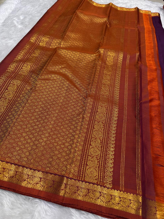 Deep Kathiripoo purple silk body showing individually spaced paisley-shaped classic-gold zari buttas.
