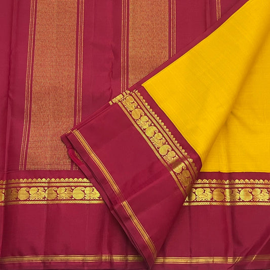 Canary yellow Kanjeevaram silk saree body close-up showing plain pure mulberry silk weave